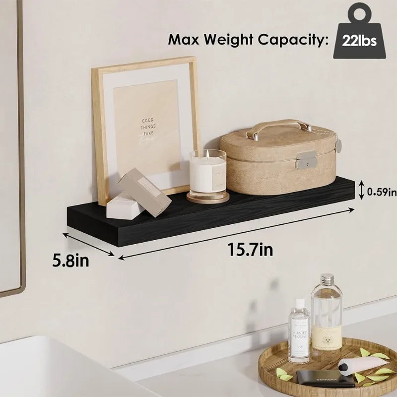 A wooden floating wall shelf organizer displaying a storage tin and candle, with weight capacity noted as 22lbs.