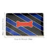 A rectangular lapel pin featuring black and blue stripes with a red bone shape in the center.