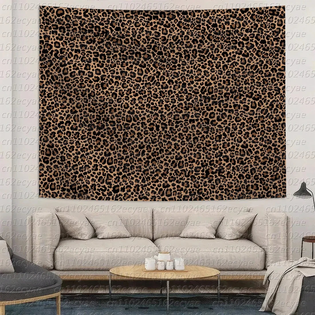 A close-up of a brown and black leopard print wall tapestry hanging on a light-colored wall.
