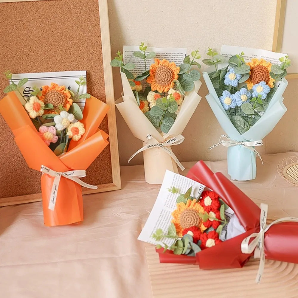 A collection of handcrafted crochet bouquets featuring sunflowers and daisies in orange, yellow, and blue tones.