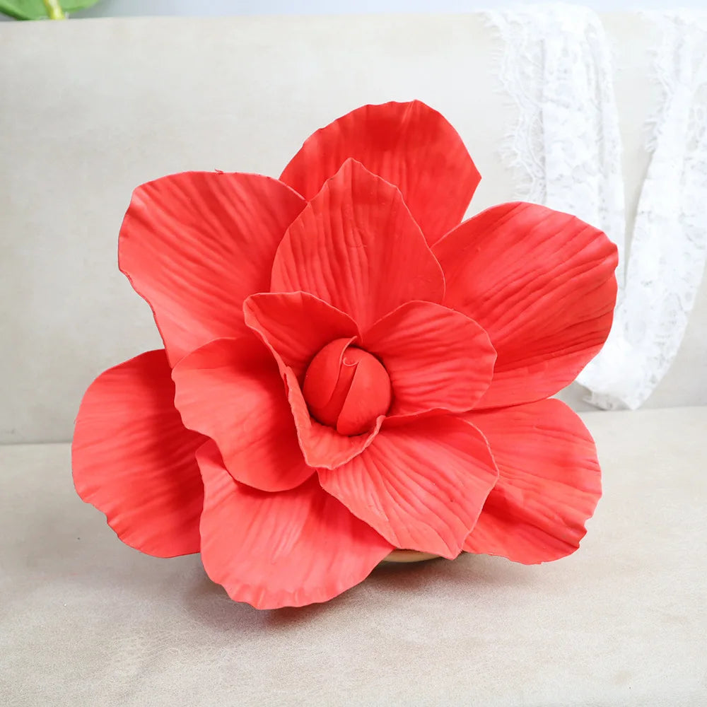 A vibrant red foam rose flower in full bloom, used for wedding and party decoration.