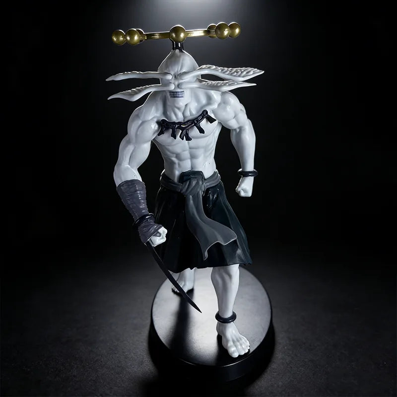 A white anime character figurine with a golden headpiece and dark clothing, displayed on a circular base.