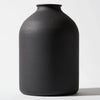A large matte black decorative vase with a smooth, rounded body.