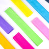 A collection of ten brightly colored crepe paper strips in yellow, green, blue, purple, and pink laid out on a white surface.
