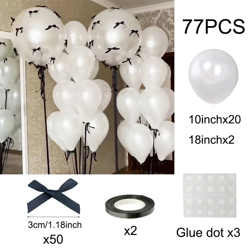 A set of 77 latex bow balloons in white, including balloons, glue dots, and ribbon for decoration.