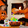 Two children play with a set of glow-in-the-dark Halloween bouncing balls and a carved pumpkin.