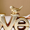 Retro gold and silver foil resin letters spelling the word LOVE
