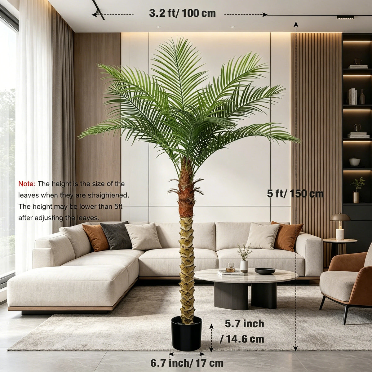 A tall artificial golden palm tree in a black pot displayed indoors against a modern wall with large windows.