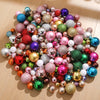 Assorted Christmas tree pendants in various glitter colors and finishes.