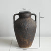 A dark brown vintage dual-sided ceramic vase with handles, shown against a white background.