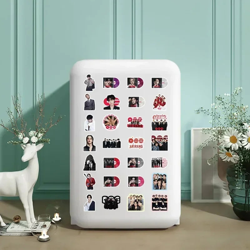 A white LED light box displaying a collection of 51 BT21 graffiti waterproof stickers on a light green wall.