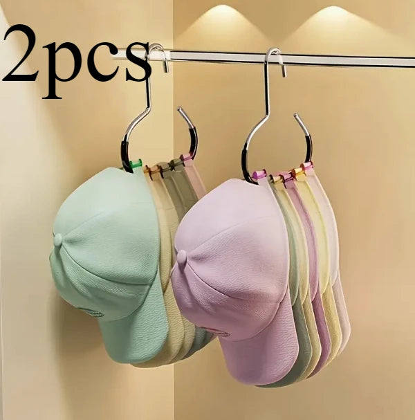 A set of two metal hat storage hooks displaying various pastel colored hats.