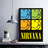 A black poster featuring the Nirvana logo in four colored squares: blue, green, orange, and yellow.