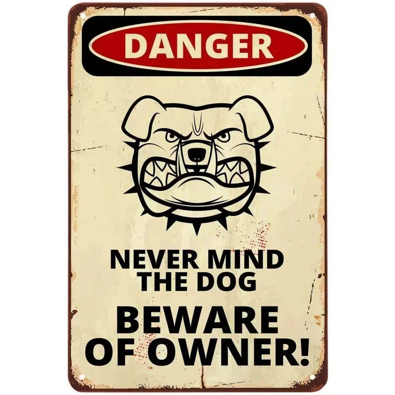 Vintage tin sign with a graphic warning about danger and beware of the dog owner.