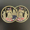 A gold-toned collectible coin featuring the Statue of Liberty and an eagle, commemorating the 250th anniversary of the United