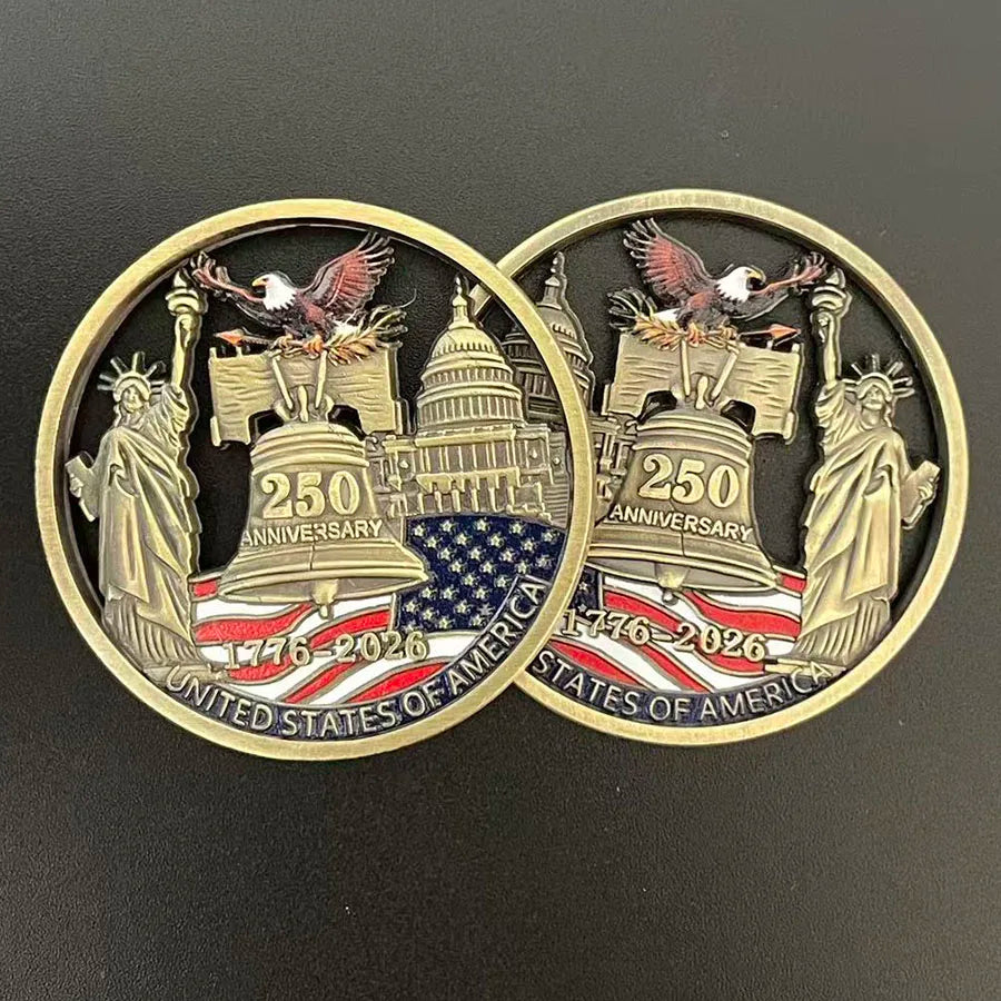 A gold-toned collectible coin featuring the Statue of Liberty and an eagle, commemorating the 250th anniversary of the United