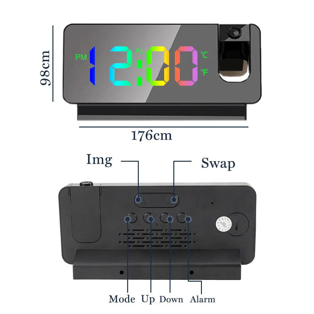 A black projection alarm clock with a digital display showing 12:00, featuring mode controls and an alarm function.