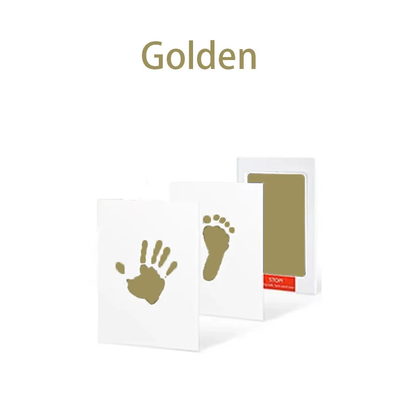 A white handprint and footprint kit with a golden theme.