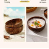 Three dark brown coconut shell serving bowls filled with a creamy white substance and garnished with orange pieces.