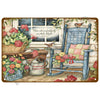 A vintage metal tin sign depicting a rustic scene with a window, potted flowers, and a wooden chair.
