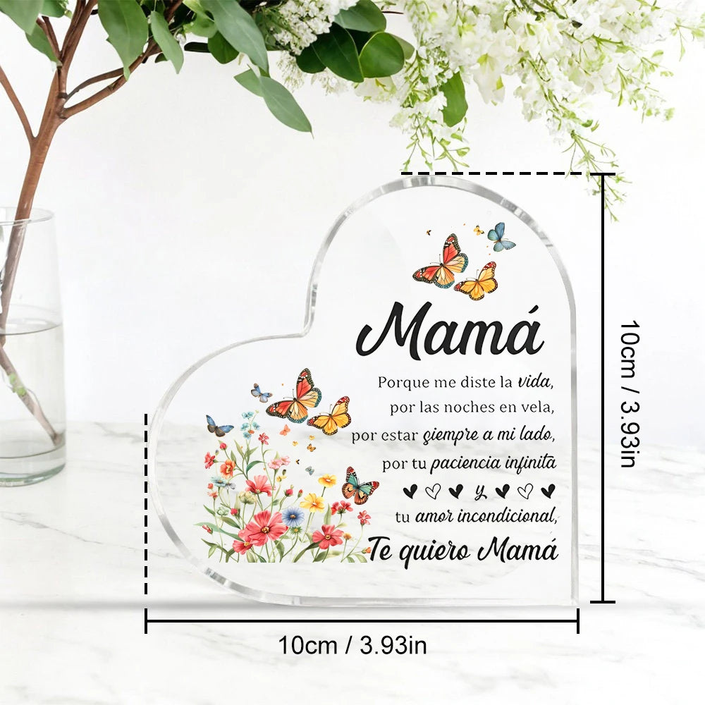 Clear heart-shaped glass ornament with floral and butterfly designs and text for Mom