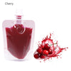 A pink dropper bottle of cherry-flavored lip oil next to a splash of crushed cherry fruit.