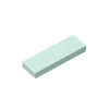 A rectangular, light mint green building brick tile.