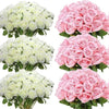 A collection of artificial silk roses in shades of white and pink arranged in bouquets.