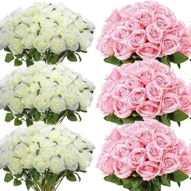 A collection of artificial silk roses in shades of white and pink arranged in bouquets.