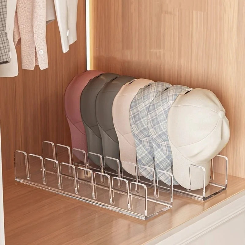 Acrylic hat storage rack displaying several pastel-colored hats in a wooden closet display.