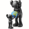 A black bear action figurine holding a blue globe.
