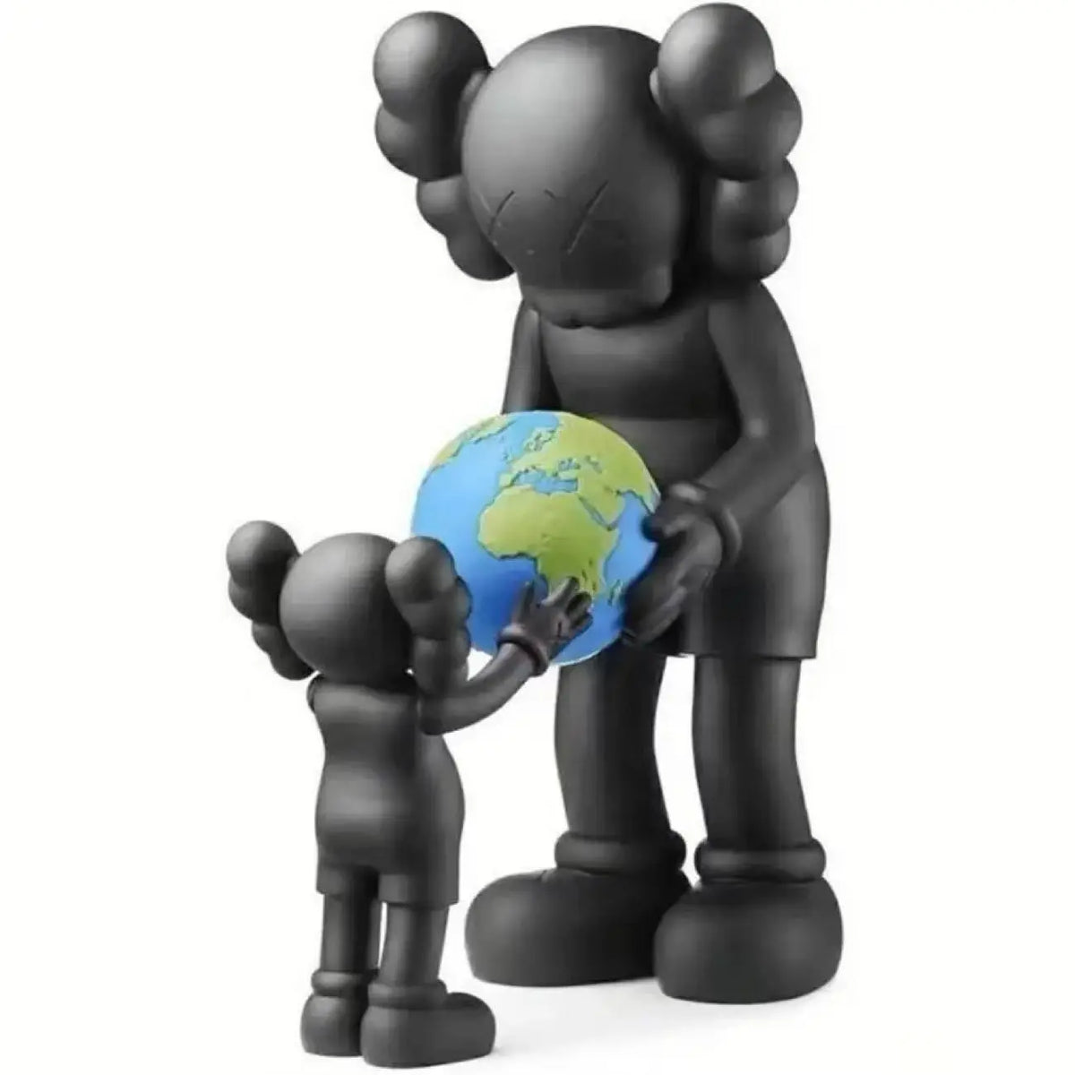 A black bear action figurine holding a blue globe.