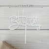 Elegant acrylic birthday cake topper with gold lettering on a white wooden background.