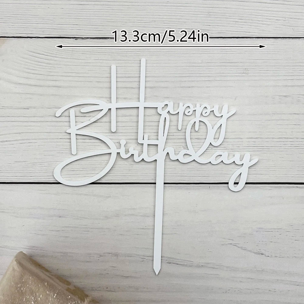 Elegant acrylic birthday cake topper with gold lettering on a white wooden background.