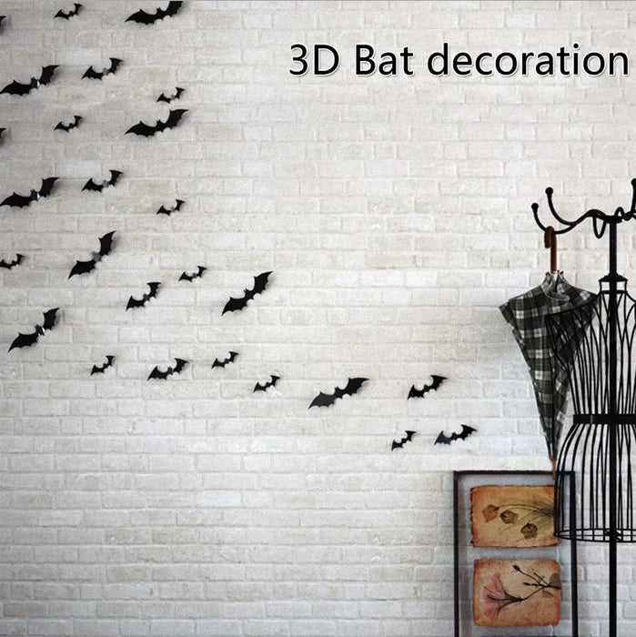 A white brick wall decorated with black bat silhouettes in flight for Halloween theme