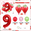 A set of strawberry themed foil balloons including number 9s, red strawberries, and various colored balloons.