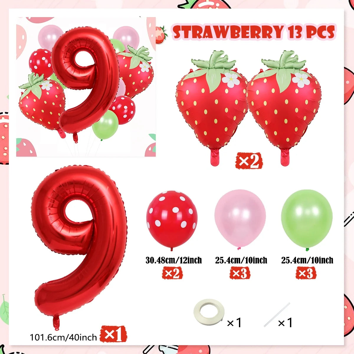 A set of strawberry themed foil balloons including number 9s, red strawberries, and various colored balloons.