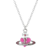 Silver pendant necklace featuring a cross and a pink heart charm with small pink stones