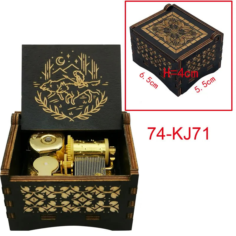 A wooden music box with a lid featuring an ornate design and a golden mechanism inside.
