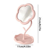 A pink sunflower heart dressing makeup mirror with a rounded frame and a flat base.
