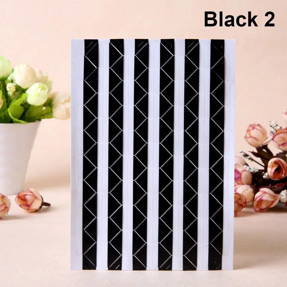 Black 2 PVC photo corner protectors with a black and white diamond pattern.