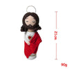 Handcrafted Virgin Mary crochet doll with dark hair and a red garment hanging from a loop.