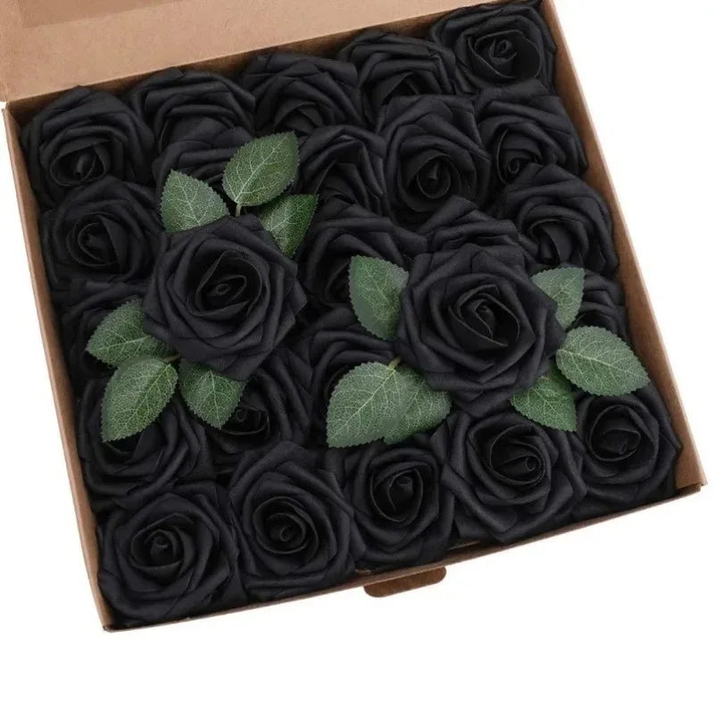 A box filled with dark black lifelike foam roses with green leaves for wedding and home décor.