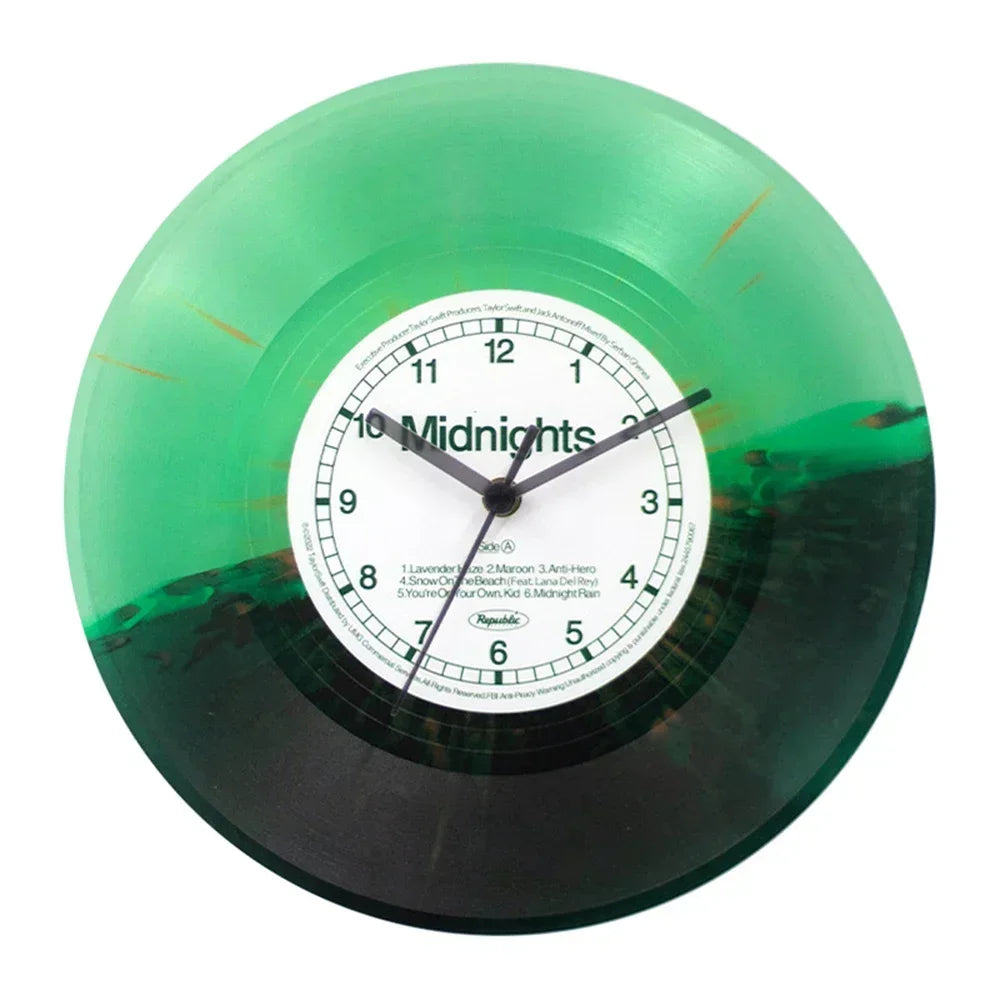 A vintage vinyl record wall clock with a transparent green cover displaying the time.