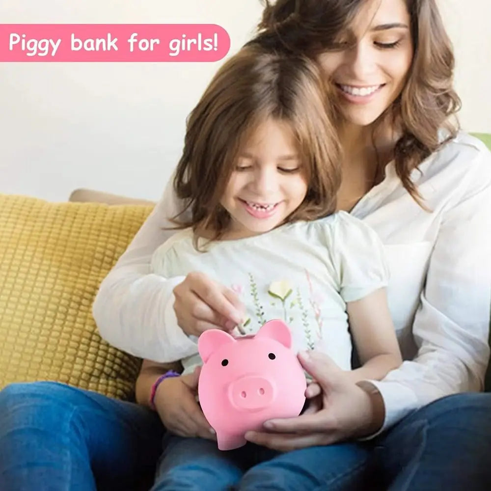 A mother is showing a young girl how to use a pink piggy bank for girls.