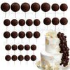 A set of dark brown spherical foam cake toppers arranged in rows.