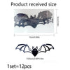 A set of twelve black bat-shaped wall decals shown in packaging with dimensions 15cm x 9cm.