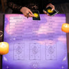 A purple altar cloth with tarot cards and candles is displayed on a wooden surface.