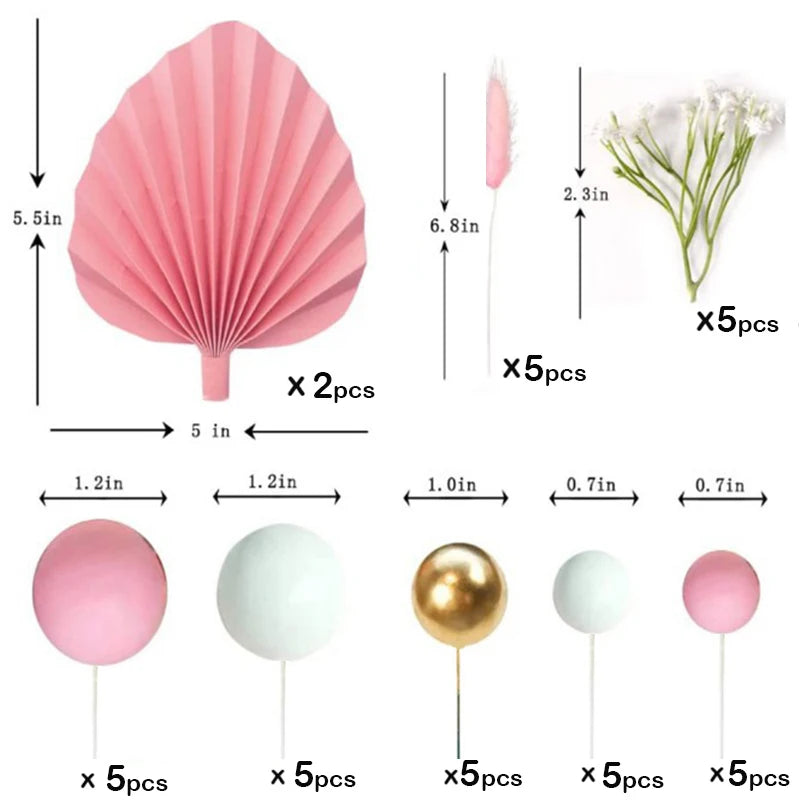 A set of pink and white palm leaf cake toppers featuring delicate flower decorations.