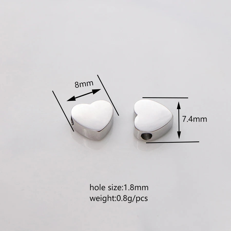 Silver heart-shaped stainless steel bead charms with a 1.8mm hole size and 0.8g weight per piece